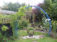 Blue arch in a blossoming garden