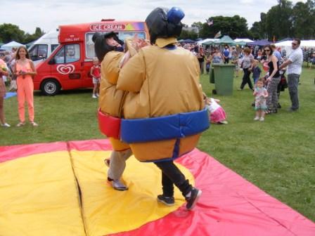 Inflatable sumo wrestlers fighting